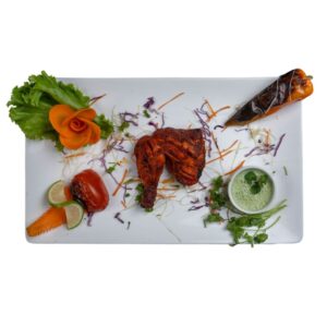 Chicken Tandoori-Half served sizzling hot with mint chutney and crispy onions at City Kebab and Cafe